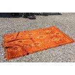 Vintage rug in red and orange