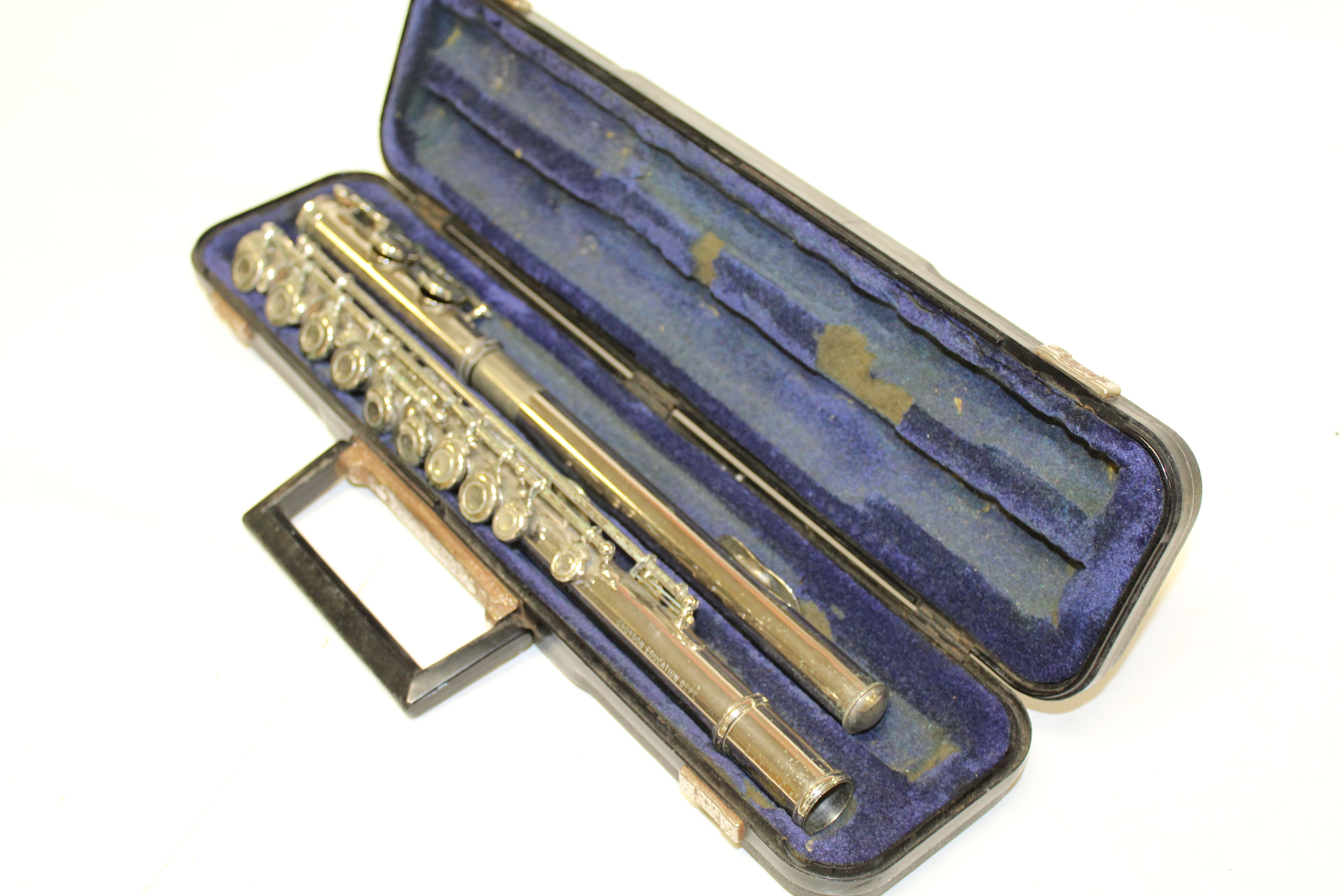 Evette flute in case together with music stand