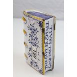 An antique English tin glazed hand warmer/ flask in the form of a book, with inscribed title 'The