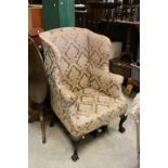 George III Style Wing Back Armchair raised on Heavily Carved Cabriole Legs terminating in Ball &