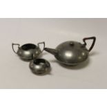 A Hutton of Sheffield hammered pewter arts and crafts tea set, number 04483.