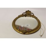 Small Gilt Framed Oval Wall Mirror with Scroll Mounts, approx. 30cms high