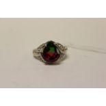 A silver CZ and pear shaped watermelon tourmaline style ring.