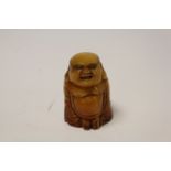 Bone netsuke of a Happy Buddha