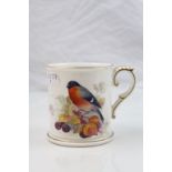 Early 20th century porcelain mug Worcester 1925 decorated with bullfinch and fruit, signed Mosely,