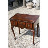 George III Low Boy with three drawers over a shaped apron raised on four cabriole legs and pad feet,
