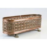 Copper Oval Jardiniere with Pierced Edge and raised on Brass Paw Feet