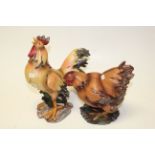 A kitchen farmhouse model of a Chicken and a Cockerel.