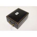 A leather cased jewellry box and contents.