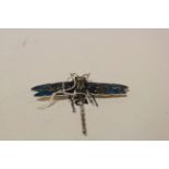 A silver and plique a jour dragonfly brooch.