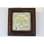 Vintage ceramic Wall tile with carved Wooden surround and Brass feet for use as a Teapot stand