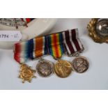 A collection of WW1 & WW2 militaria to include : A WW1 miniature medal trio , WW1 Medal Bar ,