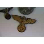 A Small Collection Of WW2 German Third Reich Cap Eagle Badges, Four Badges In Total To Include :