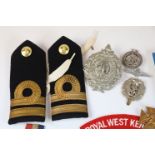 A nice collection of militaria to include : Medals, Badges, Coins, Buttons ...Etc