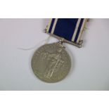 A full size Police Medal For Exemplary Service.