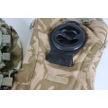 Camouflaged arms ammunition grab bag & Camelbak individual hydration system pack.