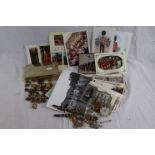 A collection of militaria to include : Postcards, Brass Buttons, Cap Badges, Medal Bar & Cigarette