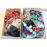 Two boxes of assorted vintage costume jewellery to include necklaces, bangles, hair slides, earrings