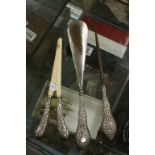 Edwardian silver handled shoe horn, button hook and glove stretchers, hammered decoration with blank