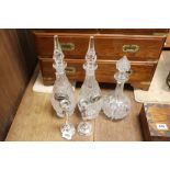 Pair of Silver Candlesticks together with Pair of Glass Decanters with Silver Plated Spirit Labels