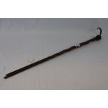 Carved walking stick with Head Knop and a Silver tipped and banded walking cane