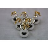 Set of Six White and Gilt Metal Pear Shaped Place / Menu Holders