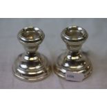 Pair of silver filled dwarf candlesticks, makers Mason & Jones, Birmingham 1928, incised border,