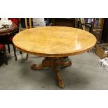 Victorian Burr Walnut Inlaid and Walnut Circular Tilt Top Centre Table raised on a large carved