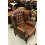 Chesterfield Style Brown Leather Studded Wing Back Armchair, probably Thomas Lloyd