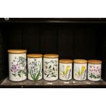 Six Portmierion storage jars in Botanic Garden pattern, all with wooden lids