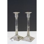 A pair of classical 19thC Corinthian column silver plated candlesticks by Mappin and Webb