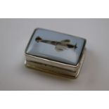 A silver pill box depicting Spitfire plane to the lid