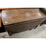 Antique Oval Oak Gate-leg Table with drawer to end and raised on turned supports with square cross-