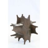 Trench Art style wooden money box with a puzzle design