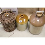 Three Stoneware Flagons, one with Wicker cover