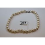 A good baroque pearl necklace with silver clasp