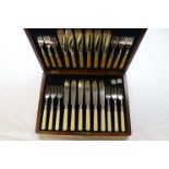 An Edwardian cased set of silver collared fish knives and forks for twelve place settings, makers