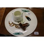 Collection of Poole Pottery to include a Charger with Crab design and a Brown glazed Squirrel