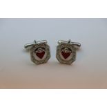 A pair of silver and heart shaped enamel set cufflinks