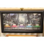 A framed hologram picture of taxi cabs in downtown New York