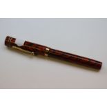 Waterman's 9ct gold lever fill fountain pen, orange and black grain design case