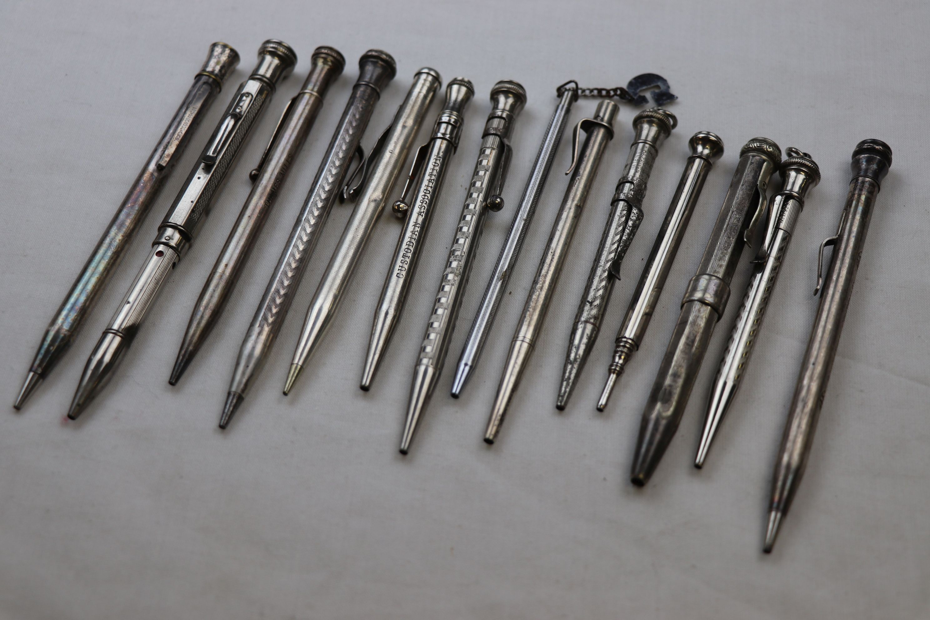 Collection of white metal propelling pencils including blue paste inset propelling pencil engraved - Image 2 of 3