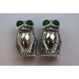 A pair of novelty continental silver condiments in the form of frogs with glass eyes