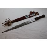 African tribal style decorative short sword with leather sheath and tassels, length approximately