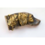A brass vesta case in the form of a dog's head