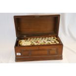 Mahogany Work box with hinged lid and Brass carry handles, containing numerous Cotton Reels,