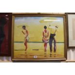 A gilt framed oil painting of figures paddling on a beach at low tide, signed