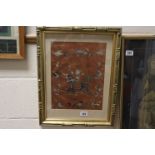 Oriental school a gilt framed embroidery on silk depicting and figure with dragon and insects