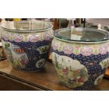 Large pair of vintage Chinese ceramic Fish bowls with glass tops and figurative panels to the sides