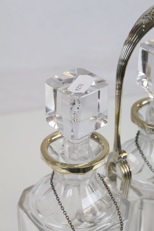 Silver plated three bottle Tantalus with original bottles, two with ceramic labels, the other with a - Image 3 of 4